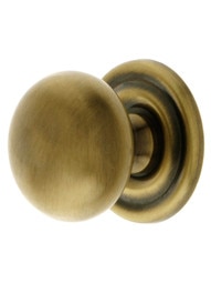 Round Brass Cabinet Knob With Rosette in Antique-By-Hand - 1 1/4" Diameter - view 2